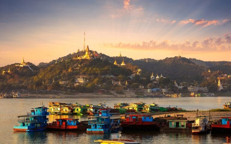 Cargo boats on the Irrawaddy River in Mandalay, Myanmar.